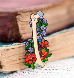 Codex Anatomicus Enamel Pins^Femur with flowers - Enamel pin
